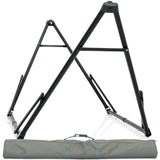 A black, metal A-frame hammock stand with a collapsible design, displayed next to a grey carrying case. A black, metal A-frame hammock stand with a collapsible design, displayed next to a grey carrying case.